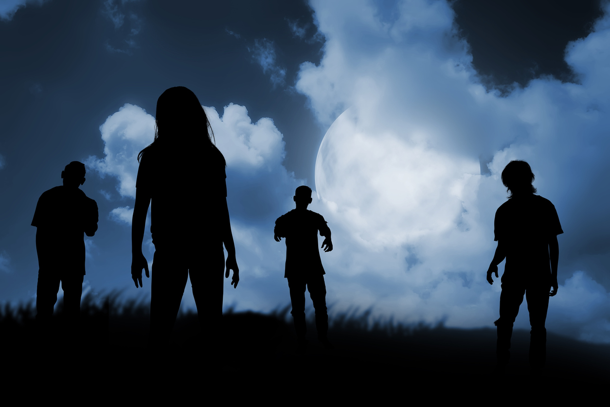 A couple of people that are standing in the dark clouds Description automatically generated