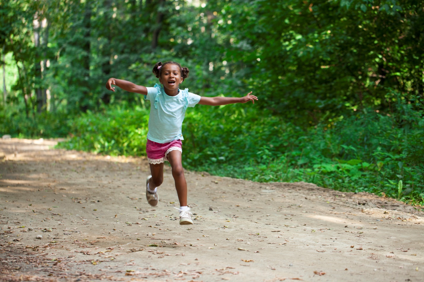 A child running on a dirt road

Description automatically generated with medium confidence