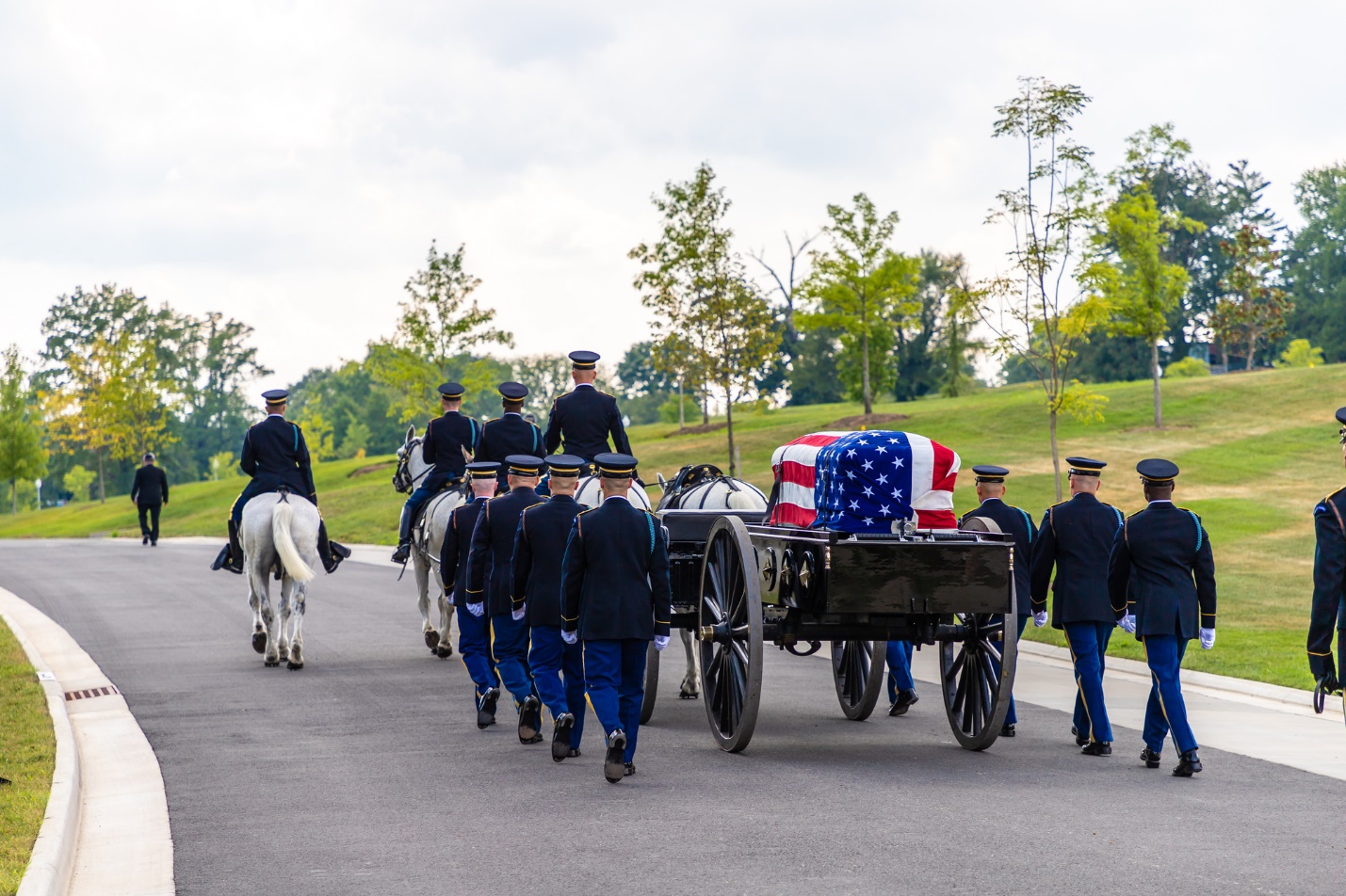 A group of people on a horse drawn carriage

Description automatically generated with low confidence