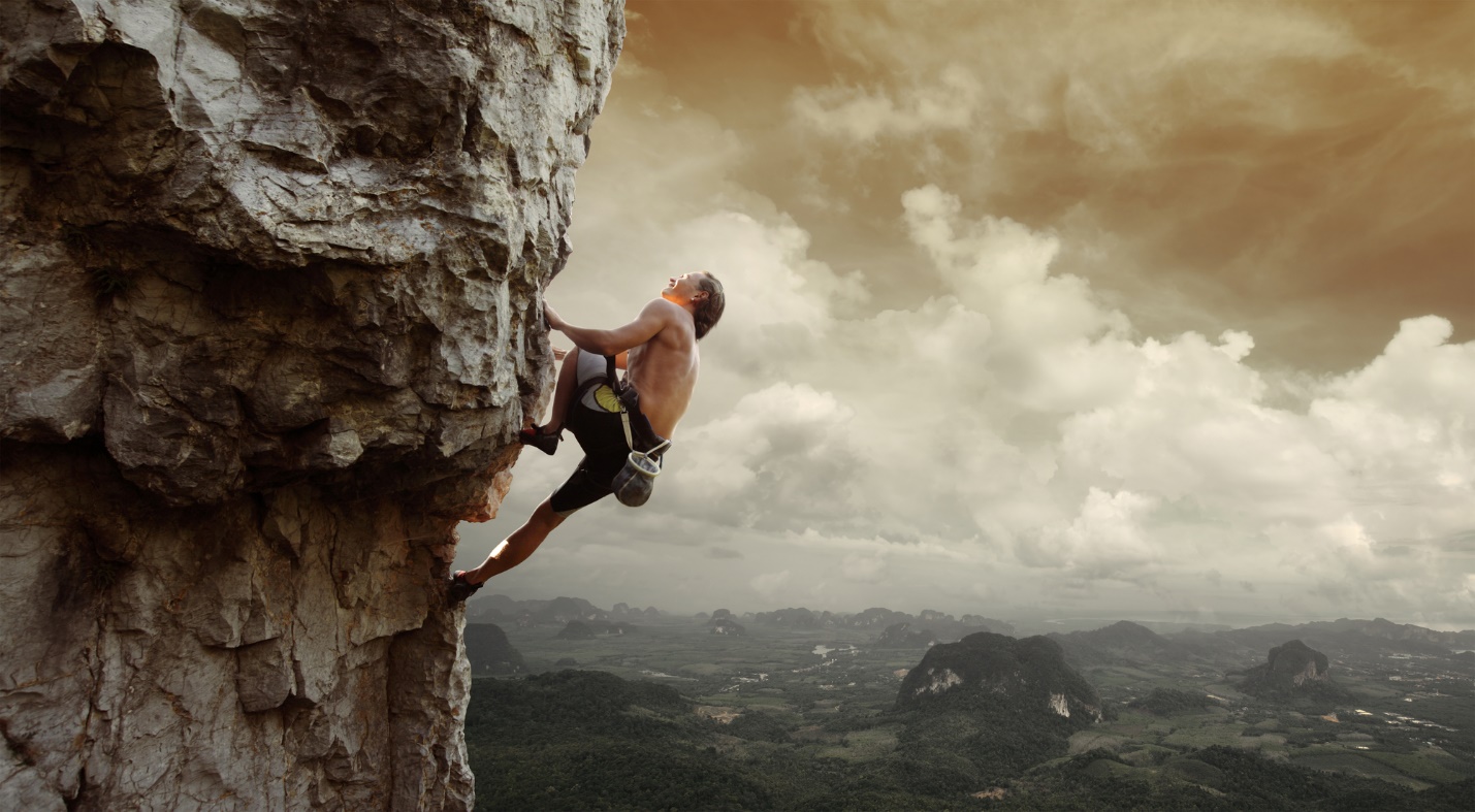 A person climbing a rock

Description automatically generated with medium confidence