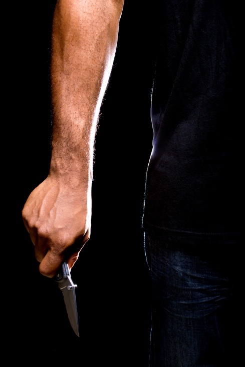 A close-up of a person holding a sword

Description automatically generated with low confidence