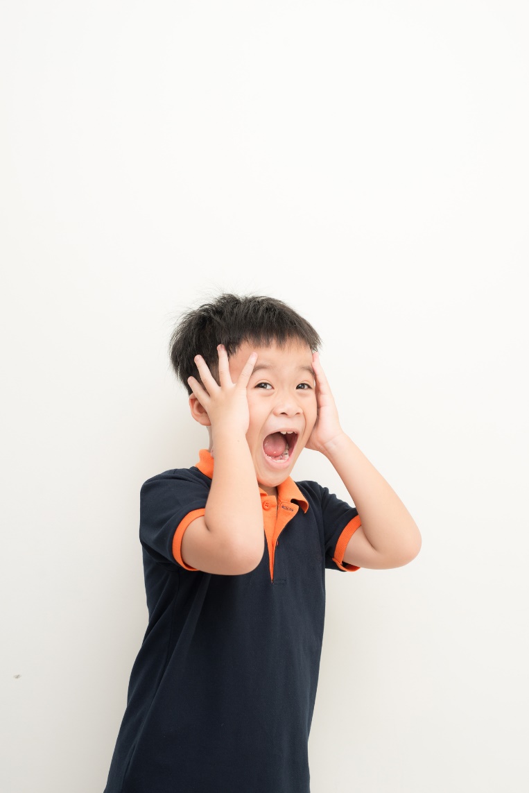 A child holding his hands to his face

Description automatically generated with medium confidence