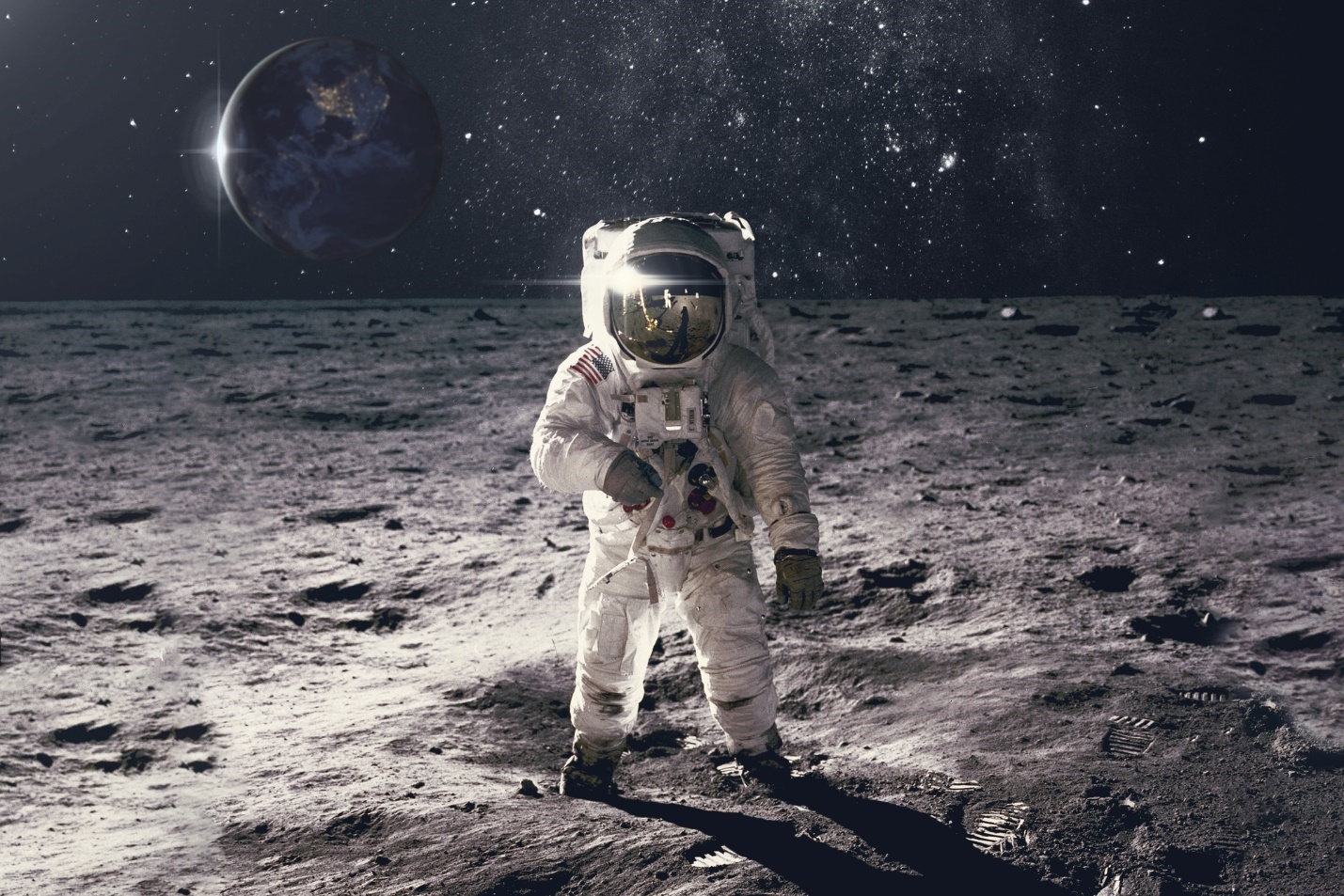 A person in a space suit on the moon

Description automatically generated with low confidence