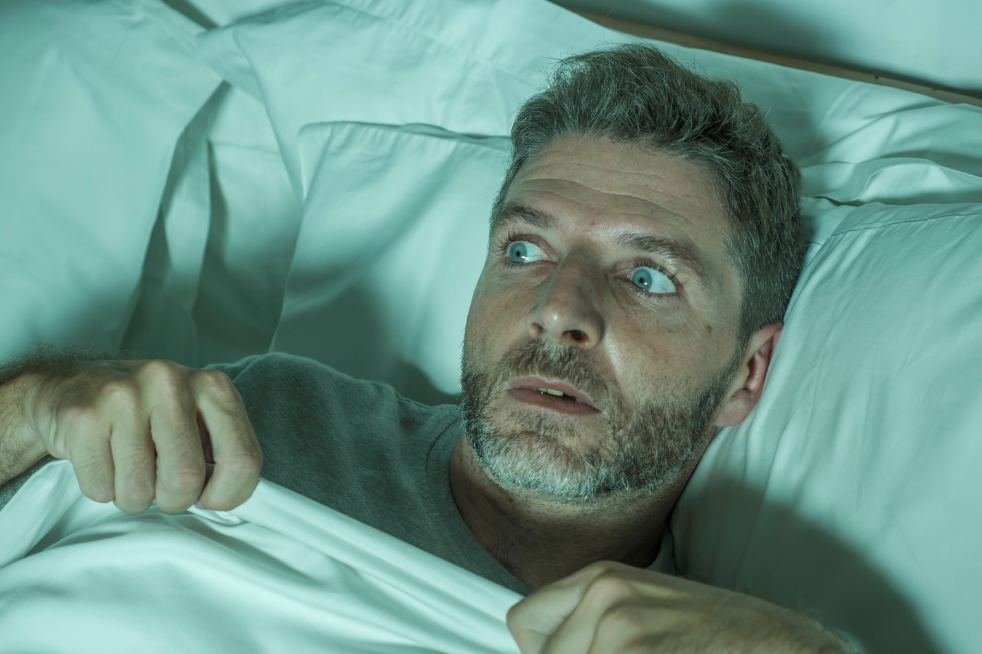 A person lying in bed

Description automatically generated with medium confidence