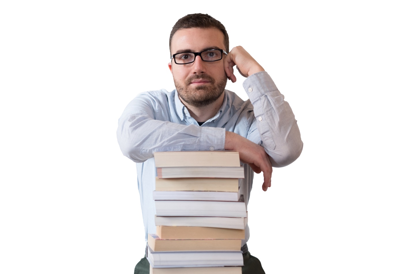 A person holding a stack of books

Description automatically generated