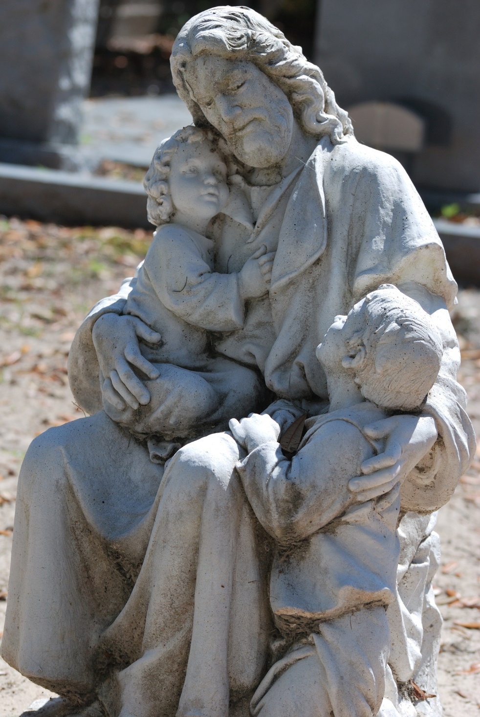 A statue of a person holding a baby

Description automatically generated with medium confidence