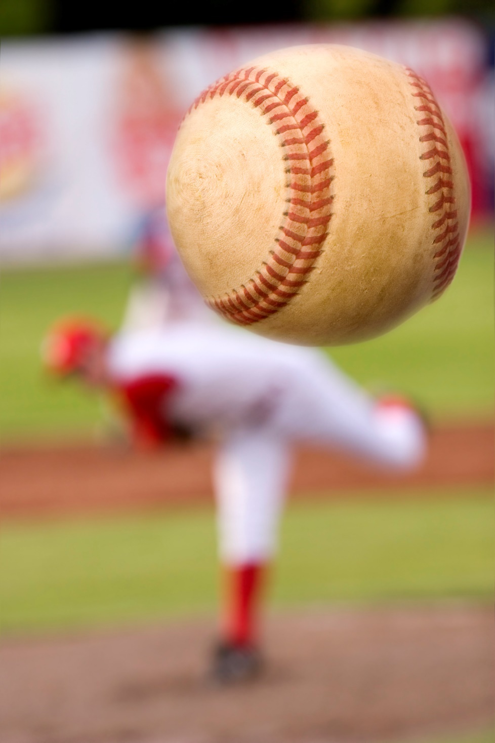 A baseball player throwing a ball

Description automatically generated with medium confidence