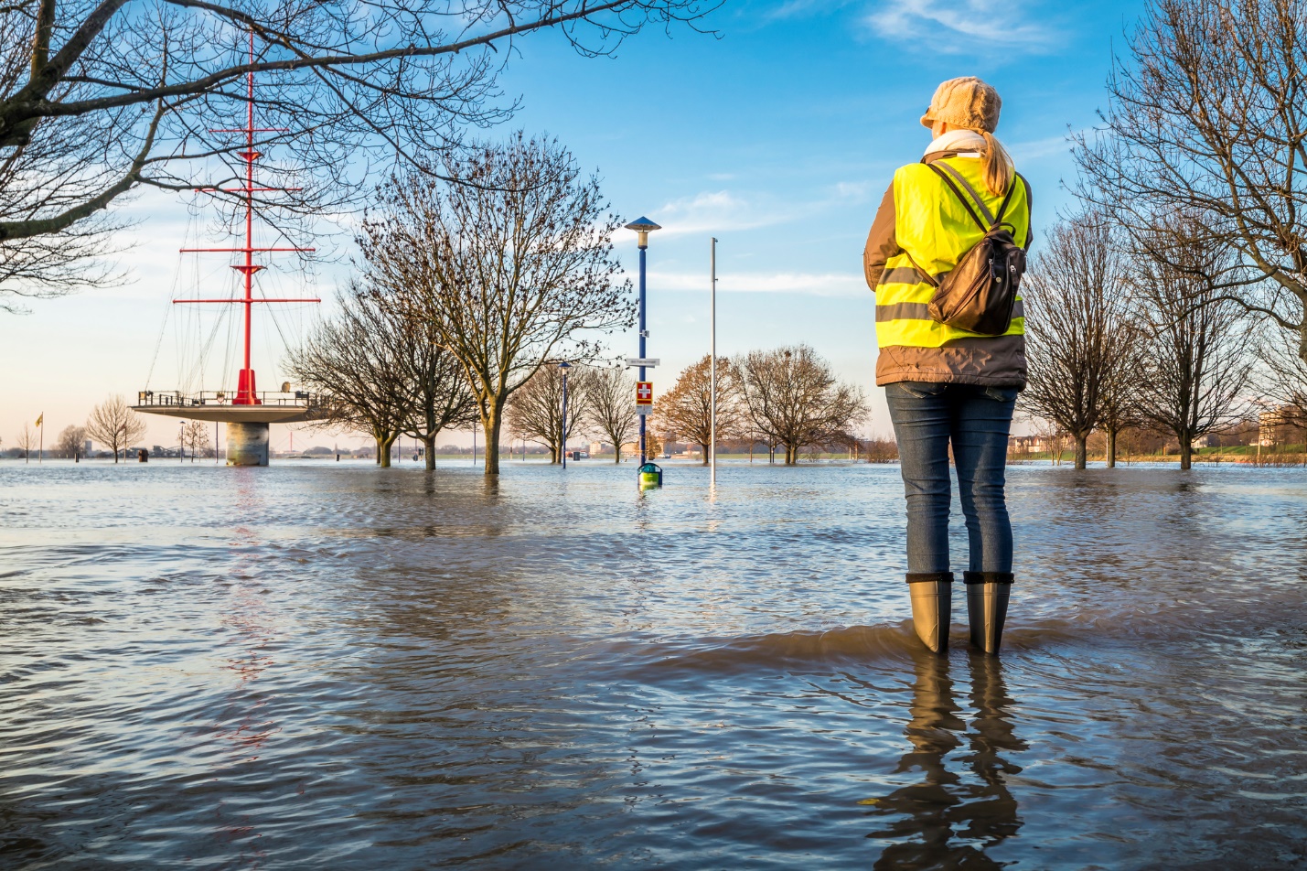 A person standing in a flooded area

Description automatically generated with medium confidence