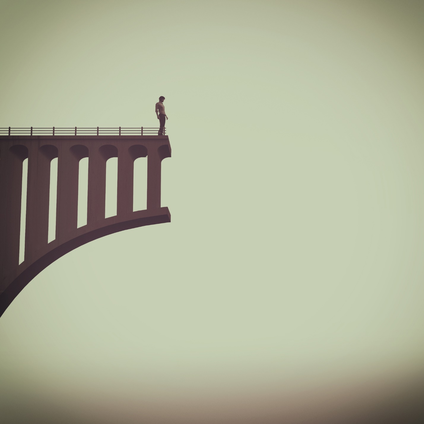 A person standing on a bridge

Description automatically generated