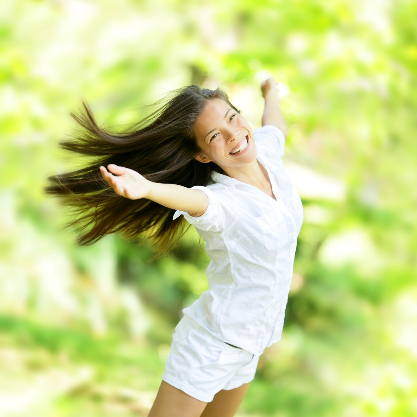 A person with her arms outstretched

Description automatically generated