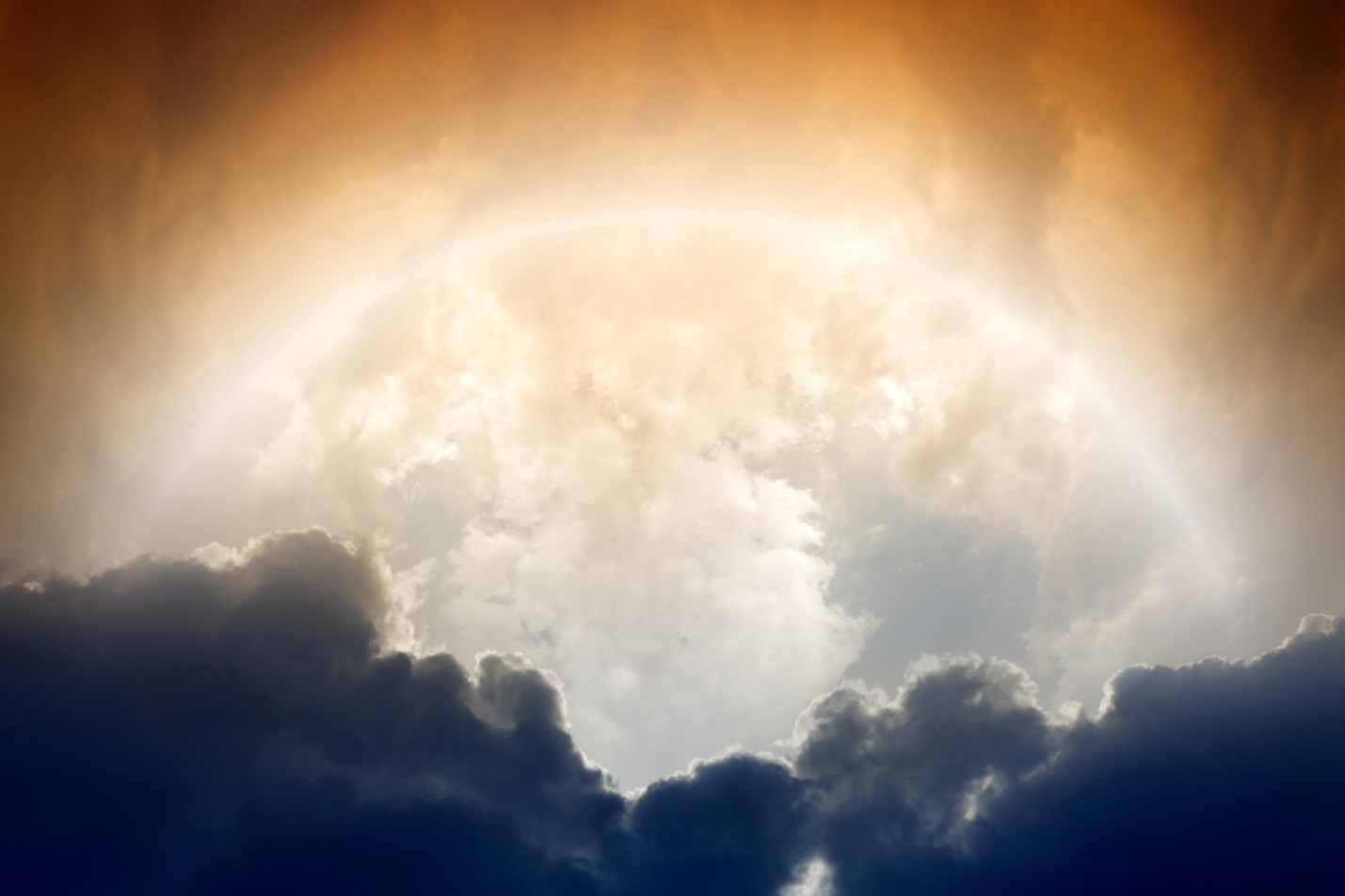 A sun shining through clouds

Description automatically generated
