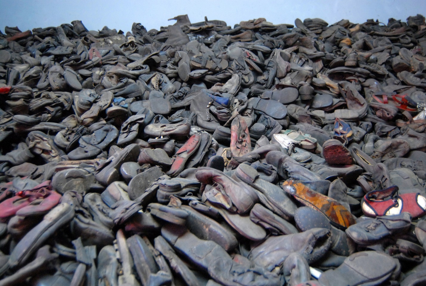 A pile of shoes on a pile

Description automatically generated