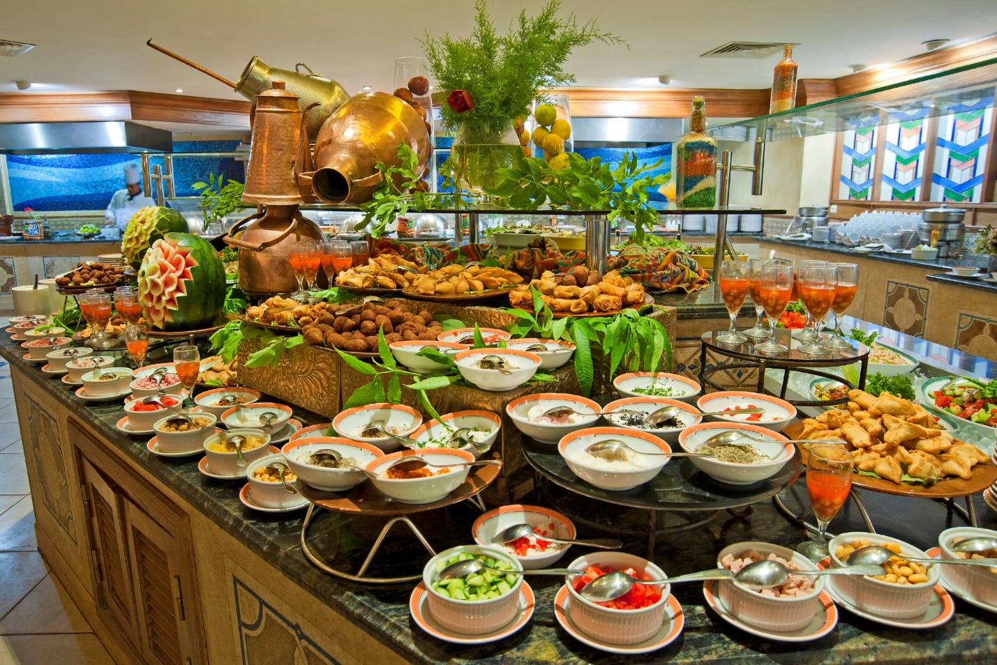 A buffet table full of food

Description automatically generated