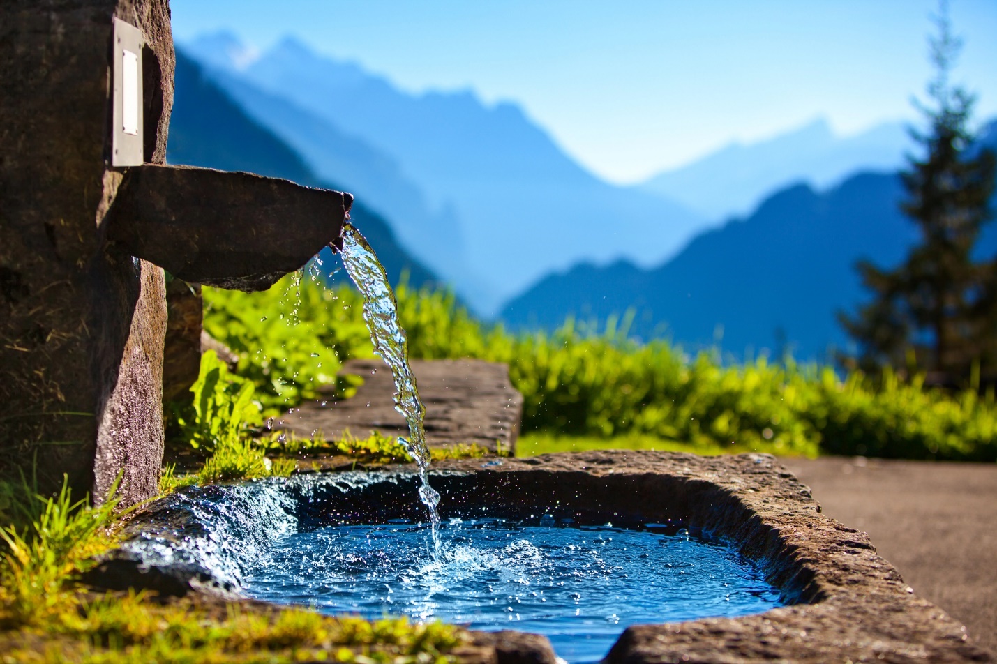 A water pouring out of a stone bowl

Description automatically generated