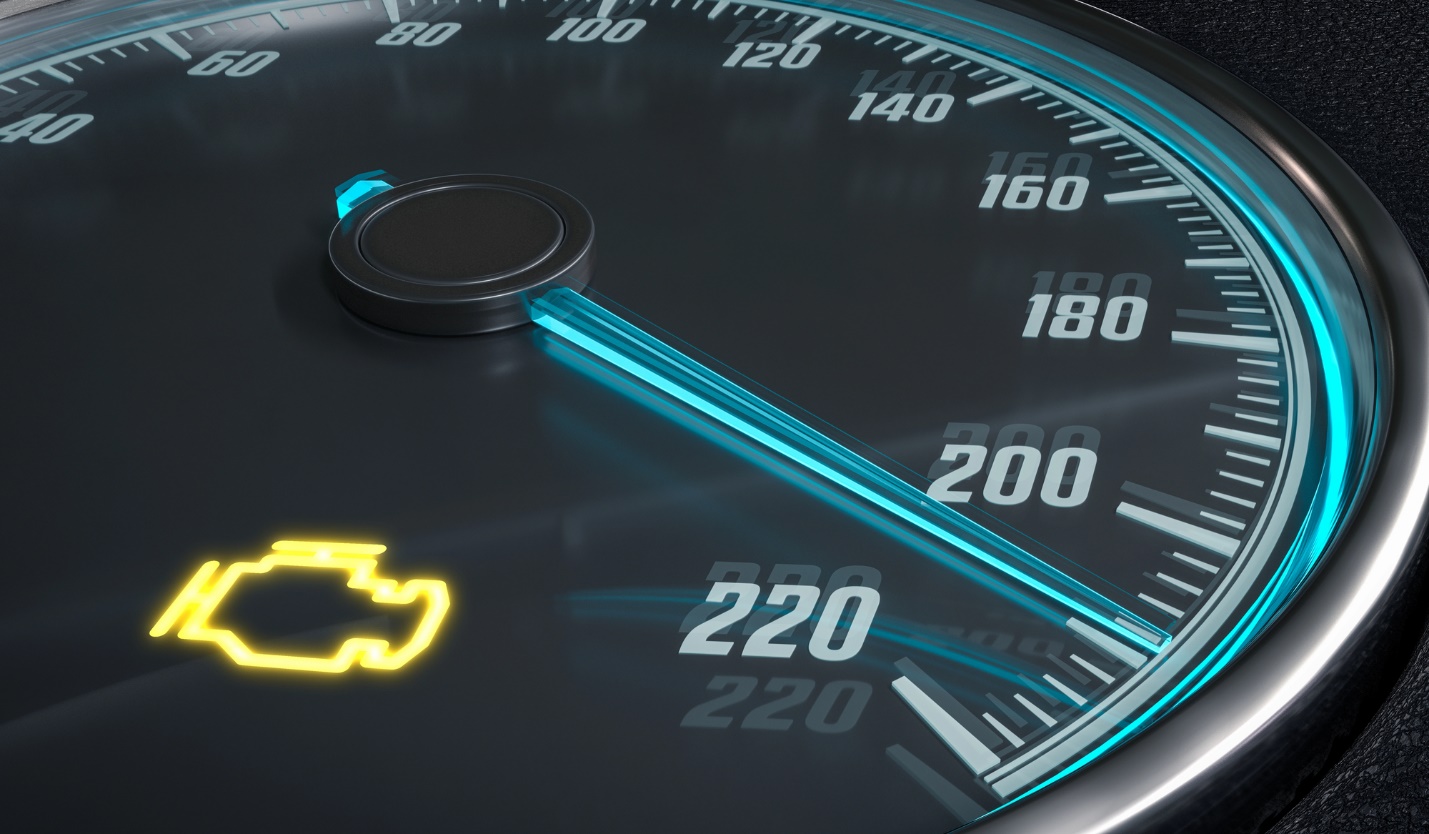 A close-up of a speedometer

Description automatically generated