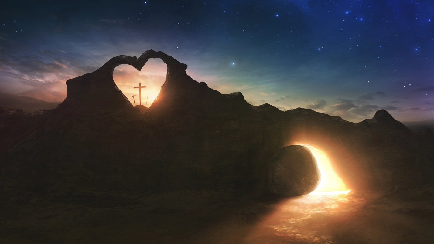 A heart shaped rock with a cross and a light coming out of it

Description automatically generated