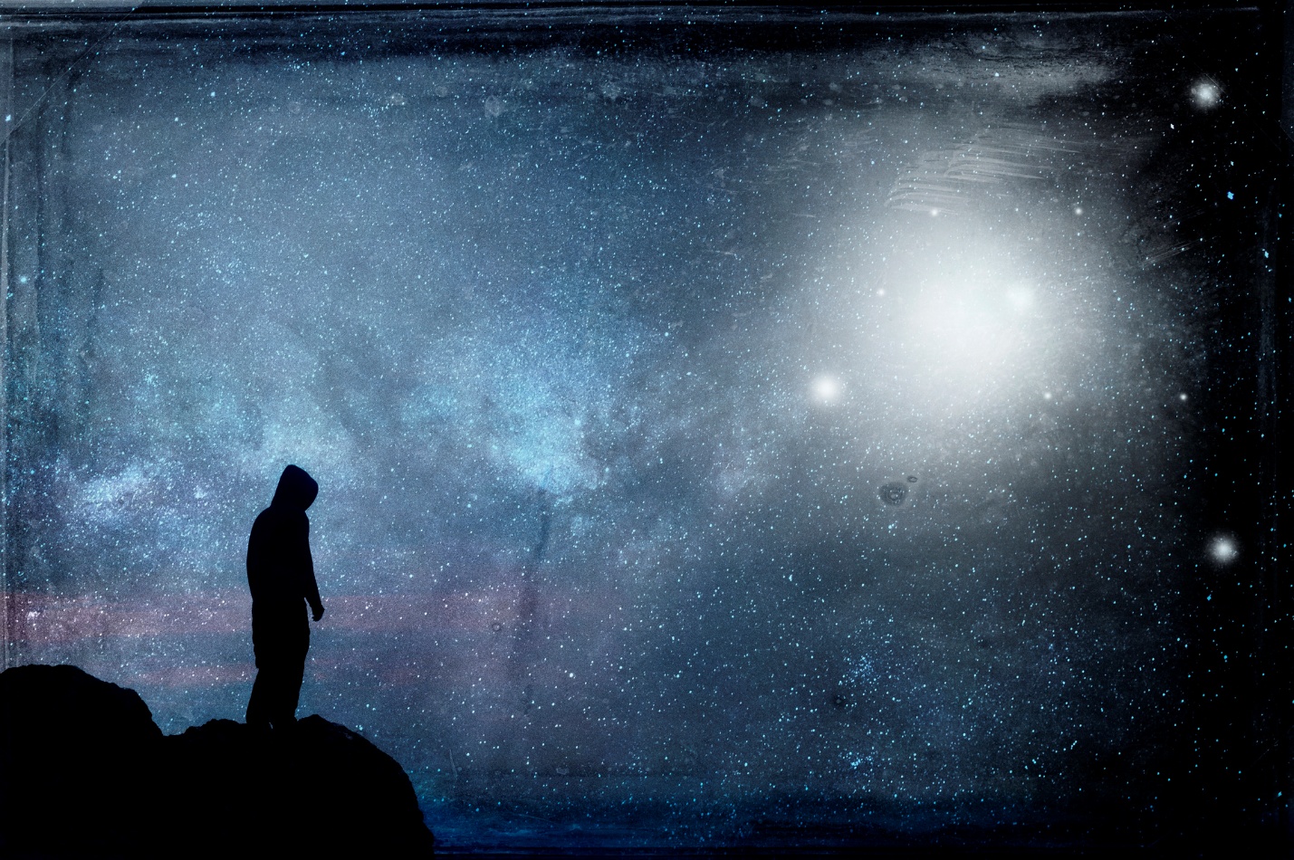 A person standing on a rock looking at the stars

AI-generated content may be incorrect.